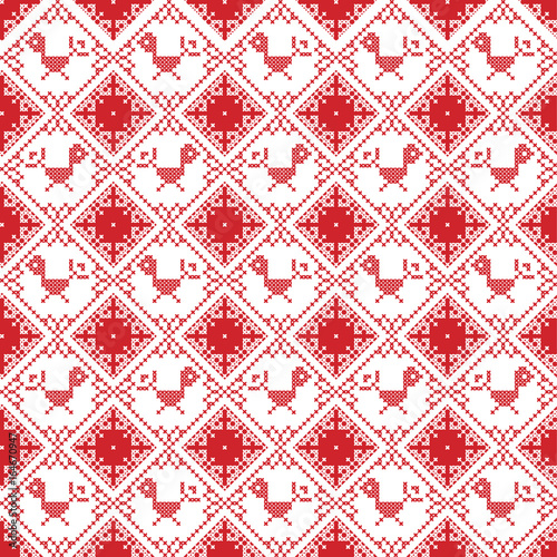 Scandinavian seamless cross stitch inspired by Nordic style Christmas pattern in cross stitch with bird Robin , star and decorative ornaments in red and white in square shape
