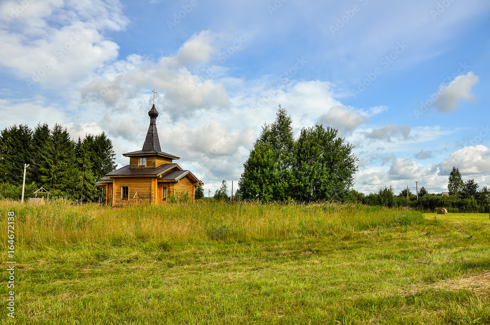Fototapeta premium Summer rural landscape with the temple.