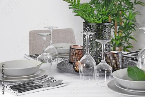 Beautiful table setting with green tropical leaf