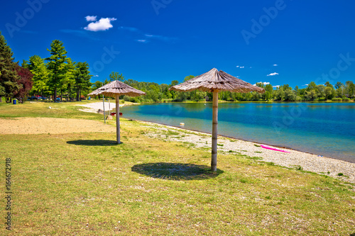 Beach and parasols on Soderica lake