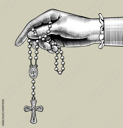 Woman's hand with prayer beads