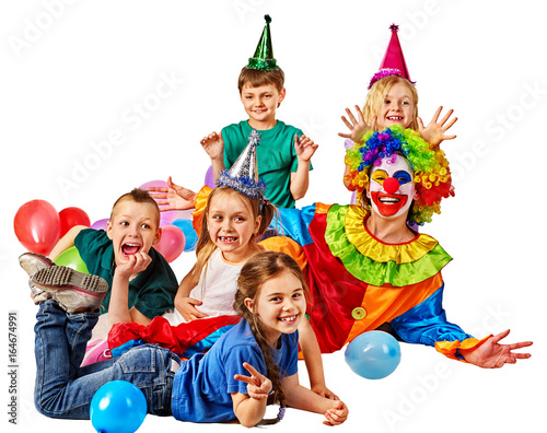 Birthday child clown playing with children and bunny fingers prank. Kid holiday cakes celebratory and balloons happiest day. Children at a children's matinee. Holiday for kids in kindergarten.