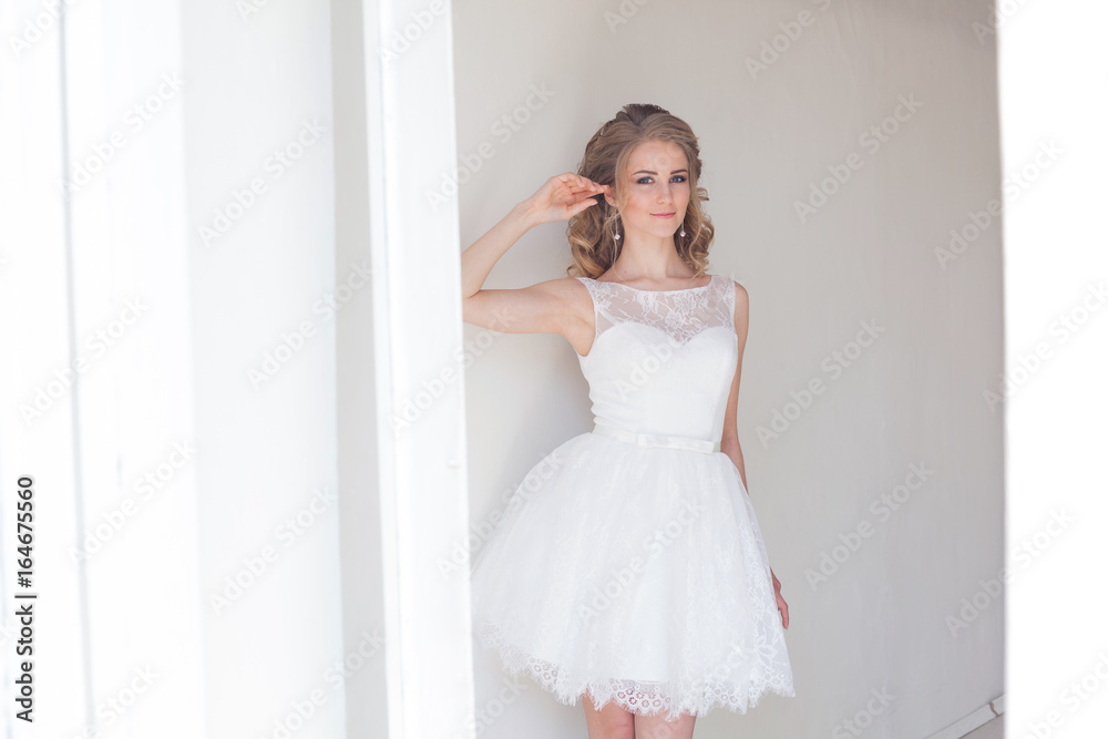 pretty girl in a short white wedding dress pretty girl in a short white wedding dress