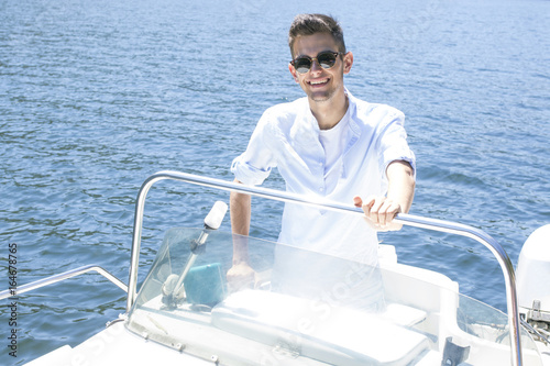 young man on the yacht's summer vacation