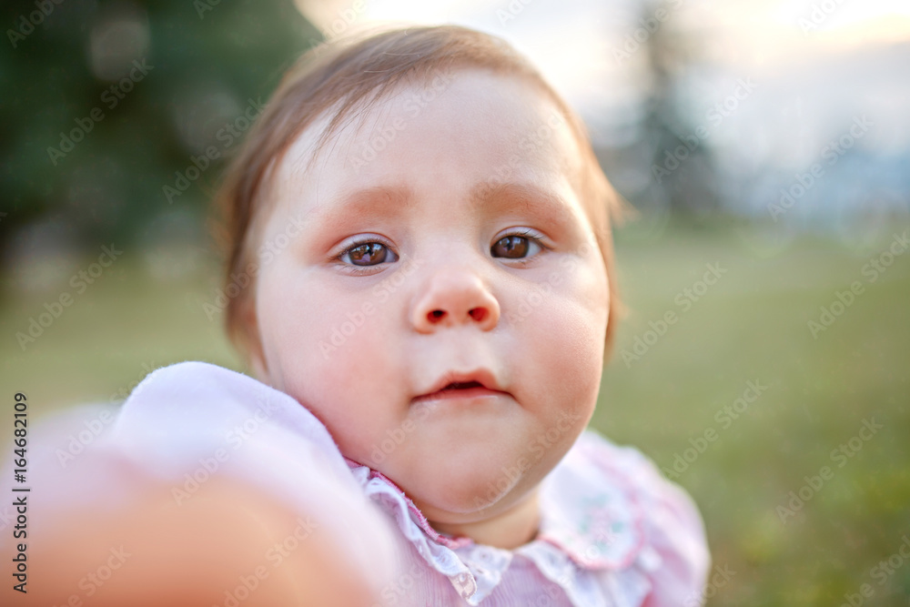 Sweet Beautiful little girl outdoors looking to the camera. Joyful, Happy, Excited. Closeup Portrait Sweet Beautiful little girl outdoors looking to the camera. Joyful, Happy, Excited. Closeup Portrait