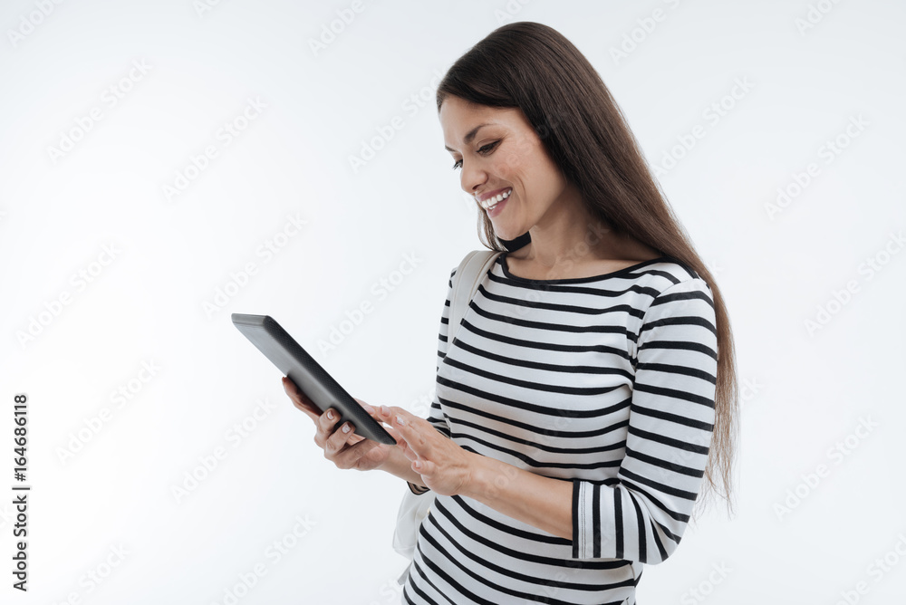 Profile photo of amazing woman that looking at her gadget Profile photo of amazing woman that looking at her gadget