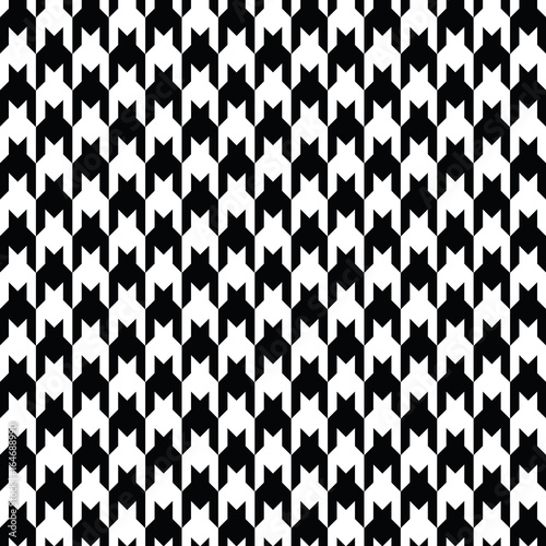 Black and white houndstooth pattern vector. Classical checkered textile design.