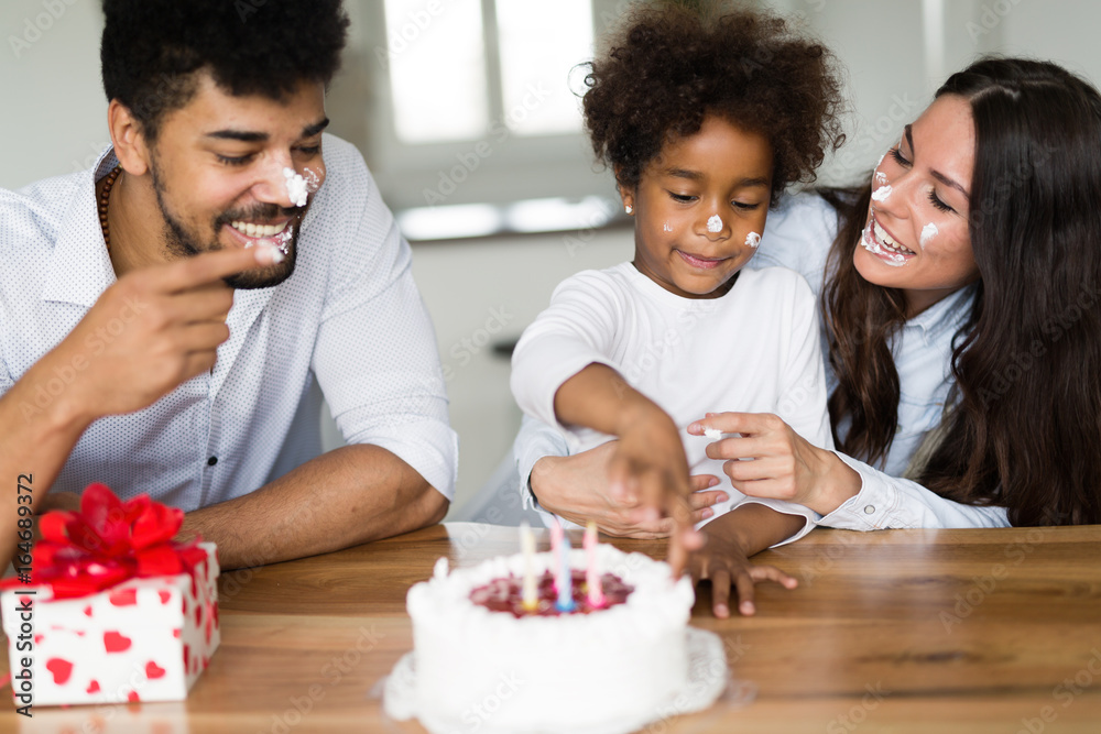 Happy family celebrating birthday of their child Happy family celebrating birthday of their child