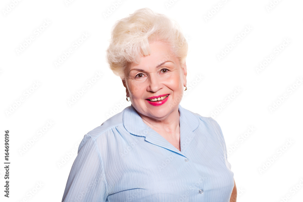 Elderly woman smiling on a white background, space for text Elderly woman smiling on a white background, space for text