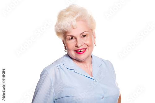 Elderly woman smiling on a white background, space for text