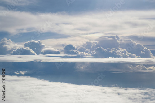 Aerial view from the plane of fluffy rain cloud in daytime - Cloudscape