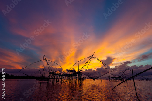 Beautiful landscape of sunrise and Yor building is traditional local fisherman used net fishing in Pakpra Thale Noi,  Phatthalung, South of THAILAND.