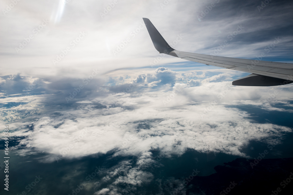 airplane wing with beautiful sky above the clouds airplane wing with beautiful sky above the clouds