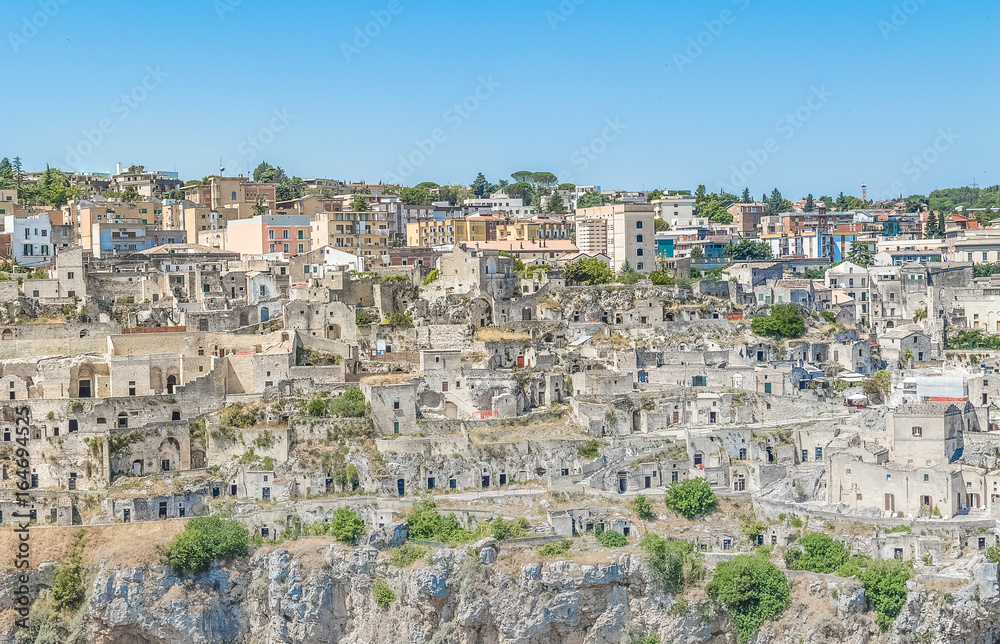 panoramic view of typical stones house (Sassi di Matera) of Matera UNESCO European Capital of Culture 2019 under blue sky. Basilicata