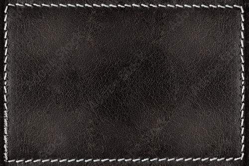 Black leather texture background with white seams