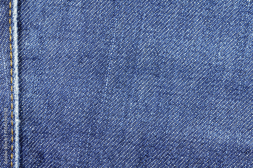 Denim jeans fabric texture background with seam for beauty clothing, fashion business design and industrial construction idea concept. Denim jeans fabric texture background with seam for beauty clothing, fashion business design and industrial construction idea concept.