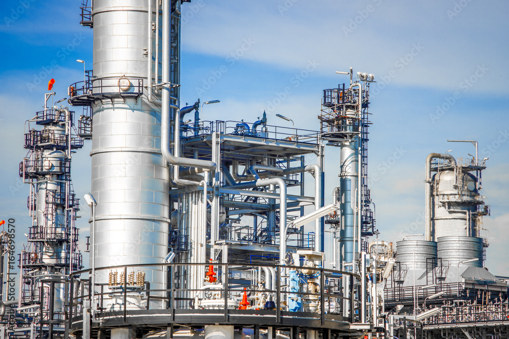 Industrial zone,The equipment of oil refining,Close-up of industrial pipelines of an oil-refinery plant,Detail of oil pipeline with valves in large oil refinery. Industrial zone,The equipment of oil refining,Close-up of industrial pipelines of an oil-refinery plant,Detail of oil pipeline with valves in large oil refinery.