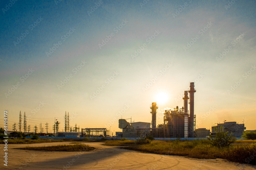 Petrochemical plant in silhouette image at sunset,Glow light of petrochemical industry on sunset and Twilight sky ,Power plant,Energy power station area