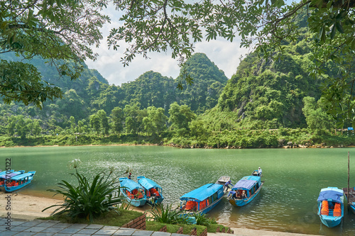 River to the Phong Nha cave with boats in the National Park of Phong Nha Ke Bang, Vietnam. photo