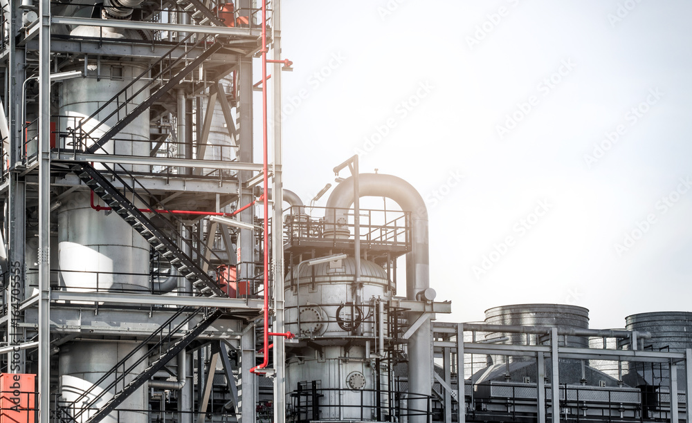 Industrial zone,The equipment of oil refining,Close-up of industrial pipelines of an oil-refinery plant,Detail of oil pipeline with valves in large oil refinery. Industrial zone,The equipment of oil refining,Close-up of industrial pipelines of an oil-refinery plant,Detail of oil pipeline with valves in large oil refinery.