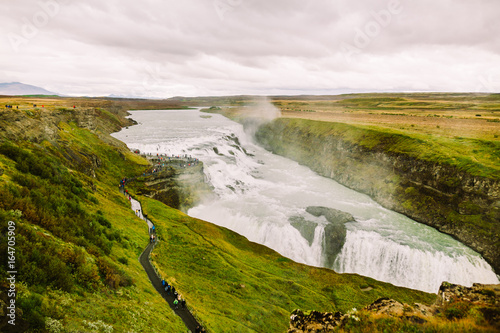 Gullfoss waterfall in Golden Circle popular tourist route in the canyon of the Hvítá river in southwest Iceland.Long exposure panorama of beautiful popular iconic Gullfoss cascade fall.