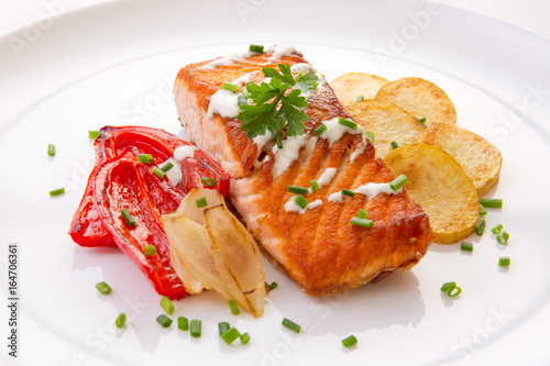 Salmon Steak with Vegetables and fried potatoes.