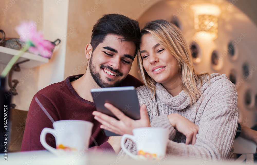 Young couple drinking coffee in a cafe. Dating, relationships, love, romance, lifestyle Young couple drinking coffee in a cafe. Dating, relationships, love, romance, lifestyle