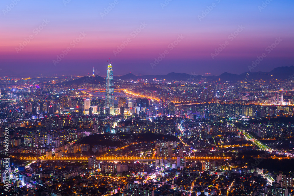 Downtown Seoul skyline and skyscraper after sunset, The best view of South Korea at Namhansanseong Fortress.