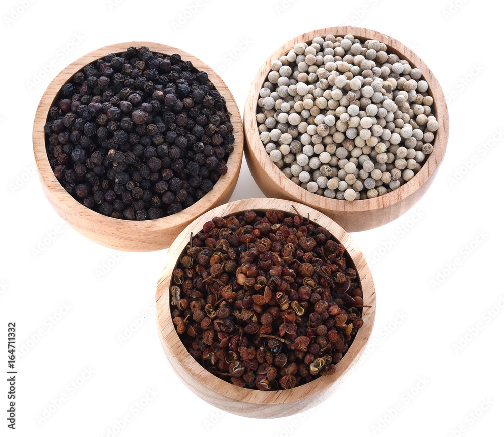 Front view of 3 organic pepper Piper nigrum in wood bowl Front view of 3 organic pepper Piper nigrum in wood bowl