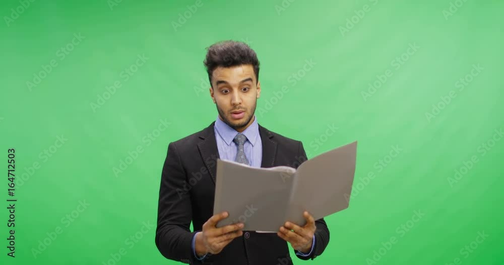 Serious Businessman Read Documents Over Chroma Key Green Screen Hold Reports Pensive Having Problem Portrait of Young Latin Business Man Serious Businessman Read Documents Over Chroma Key Green Screen Hold Reports Pensive Having Problem Portrait of Young Latin Business Man