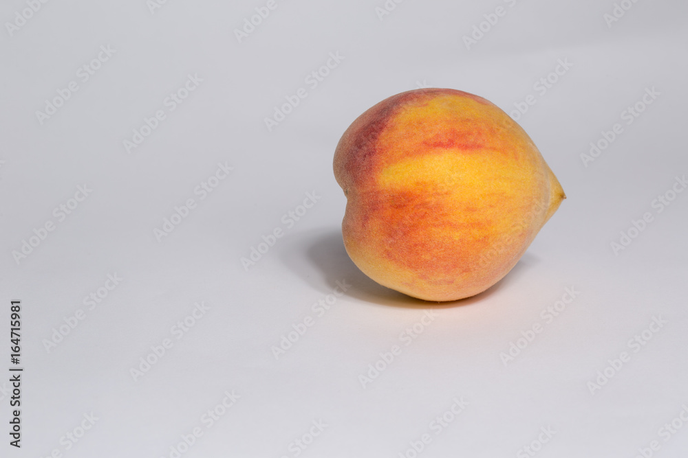single ripe peach isolated on white background single ripe peach isolated on white background