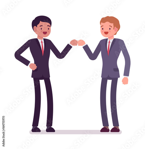 Businessmen fist bump