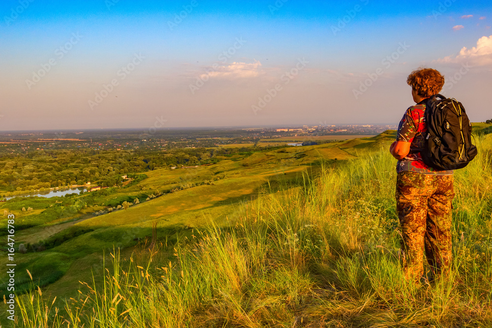 Fototapeta premium The woman the tourist at top.