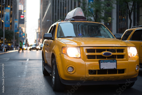Yellow Cab in Manhattan - New York City. Taxi car in city at sunset.  © Laszlo