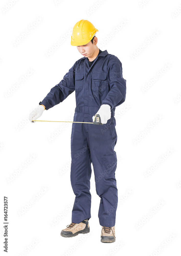 Young worker in unifrom with tape measure on white Young worker in unifrom with tape measure on white