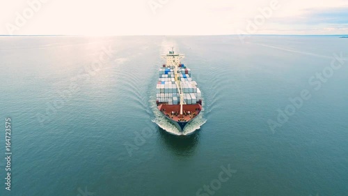 Aerial view of container vessel sailing in open sea photo