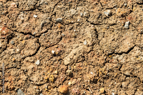 crack dry soil and rock on the ground at the summer season. El Nino and global warming are affected by climate change.