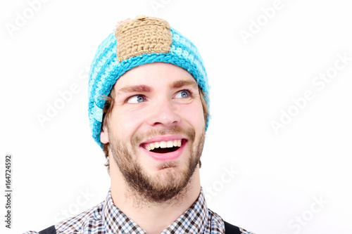 Man in winter hat and plaid shirt isolated on white