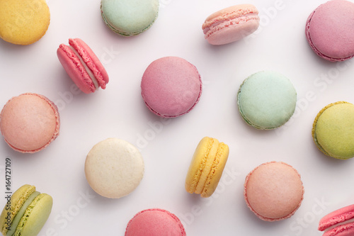 Macarons pattern on white background. Colorful french desserts. Top view