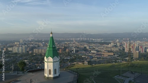 Church of Paraskeva Pyatnitsa is symbol of Krasnoyarsk. City in Siberia, Russia. Russian old architecture. Aerial drone flight around. 4K format photo