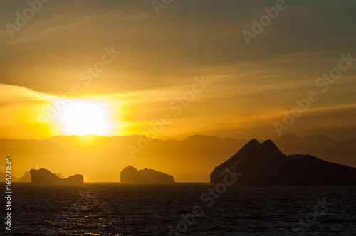 Icebergs in Antarctica at sunset © David