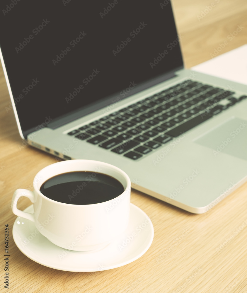 hot black coffee with laptop and white paper hot black coffee with laptop and white paper