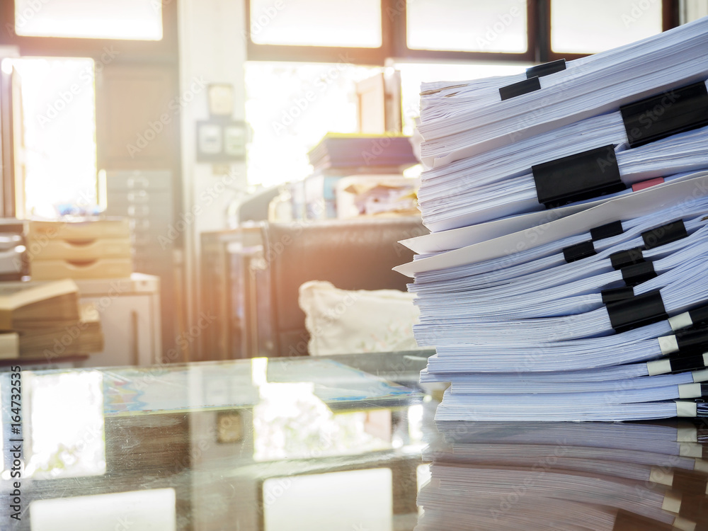 Close up of business documents stack on desk , report papers stack Close up of business documents stack on desk , report papers stack