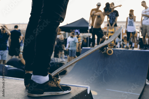 Group of skaters waiting for their turn on the slide