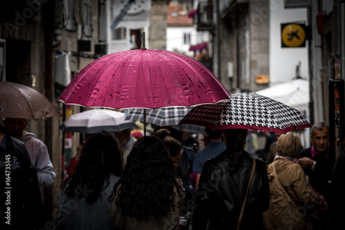 People walking with umbrellas