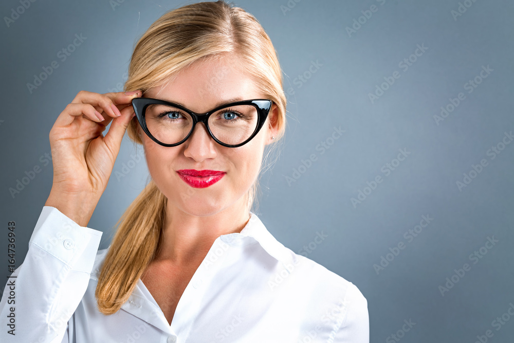 Happy young woman on a gray background Happy young woman on a gray background