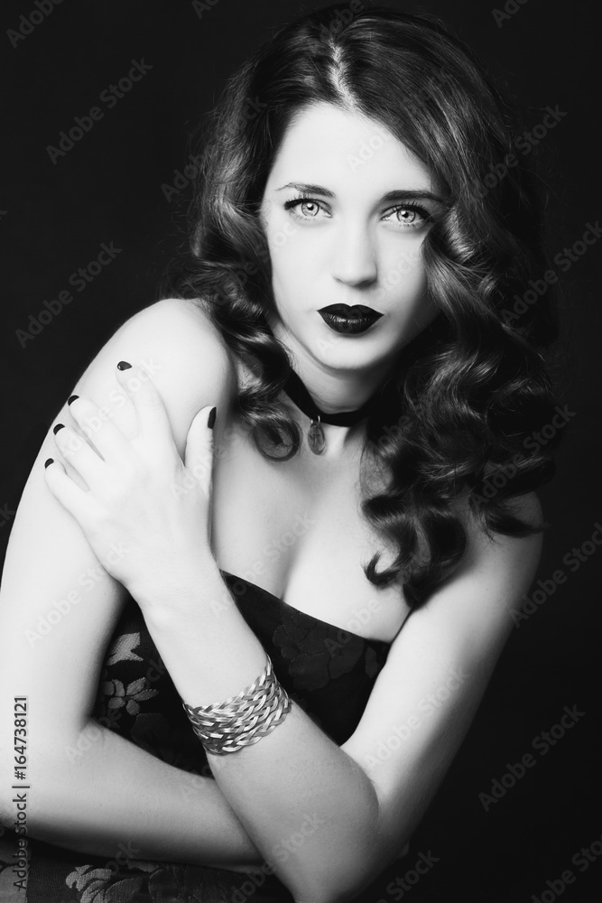 Pretty female fashion model posing in studio with dark gothic make up Pretty female fashion model posing in studio with dark gothic make up