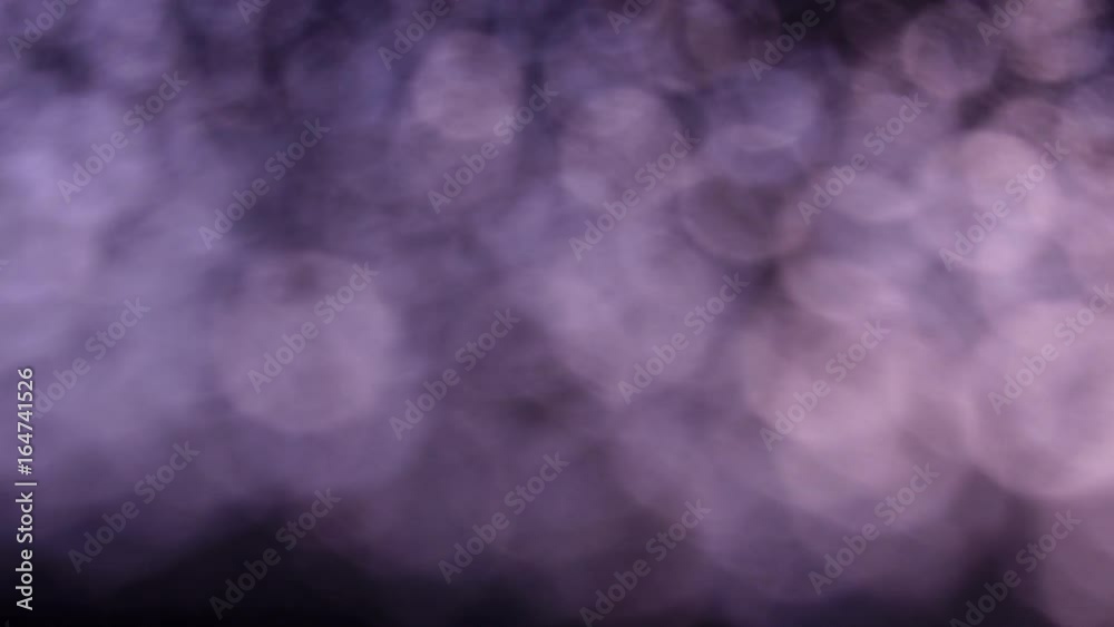 River of specks on dark background. Amazing vibrant beams very out of focus. Hypnotic motion of toned bubbles. Excellent abstract meditative and relax intro with gleams in 4k, 3840x2160, clip.
