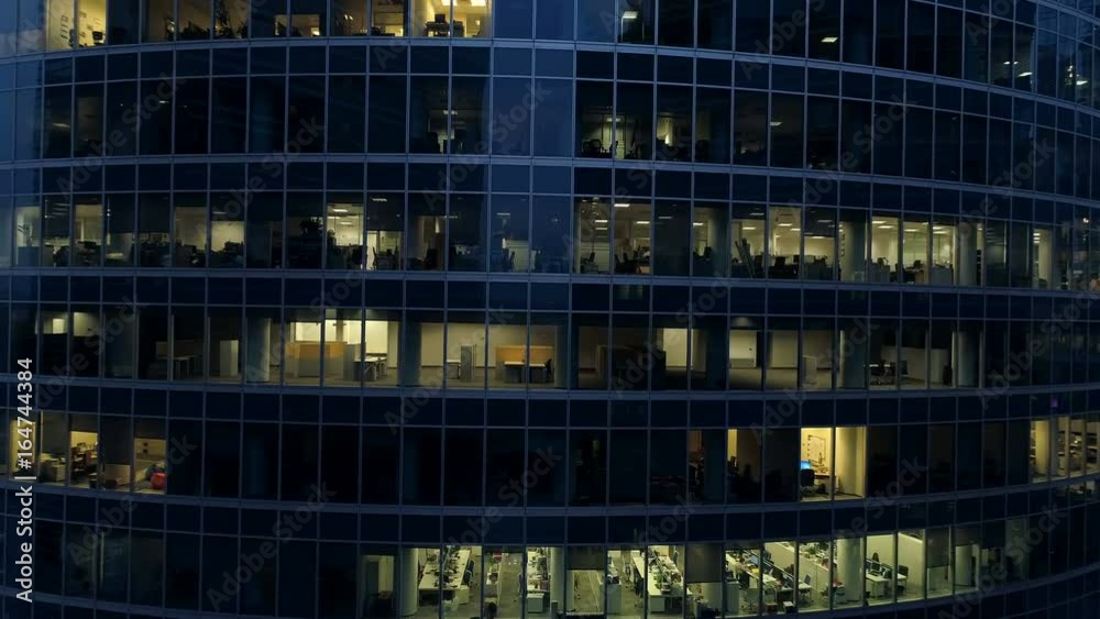Empty office windows of skyscrapers at late evening. 4K. Empty office windows of skyscrapers at late evening. 4K.