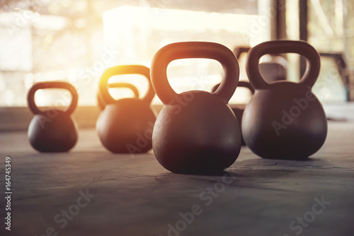 Closeup of kettlebell weight on gym floor photo